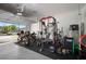 Spacious garage with motorcycles and a complete home gym setup at 10005 Sage Creek Dr, Ruskin, FL 33573