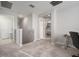 Second floor landing with stairway, access to bedroom and bathroom, with space for an office or study area at 10005 Sage Creek Dr, Ruskin, FL 33573