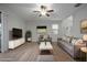 Bright living room featuring modern furniture, neutral tones, and hardwood floors at 10005 Sage Creek Dr, Ruskin, FL 33573