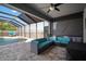 Comfortable outdoor space with teal seating overlooking the pool area at 10005 Sage Creek Dr, Ruskin, FL 33573