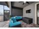 Cozy screened patio features a ceiling fan, outdoor furniture, and a mounted television at 10005 Sage Creek Dr, Ruskin, FL 33573