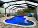 Private, screened-in swimming pool with brick paver deck, fountain and spray water features, and ample seating at 10005 Sage Creek Dr, Ruskin, FL 33573