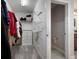 Spacious walk-in closet includes shelving, hanging racks, drawers, and connects to the bathroom at 10005 Sage Creek Dr, Ruskin, FL 33573