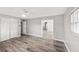 Clean bedroom offering wood-look flooring, a ceiling fan and large closets at 1002 Fruitland Ave, Bradenton, FL 34207