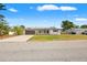 Charming home with fresh exterior paint, manicured lawn, and a driveway at 1002 Fruitland Ave, Bradenton, FL 34207