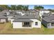 Home backyard features covered patio perfect for outdoor relaxation at 1043 Davis Heather Cir, Seffner, FL 33584