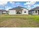 The spacious backyard features a covered patio perfect for outdoor enjoyment at 1043 Davis Heather Cir, Seffner, FL 33584