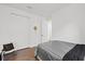 Minimalist bedroom with a gray bed, closet, and a chair, providing a calm and uncluttered space at 1043 Davis Heather Cir, Seffner, FL 33584