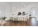 Open-concept kitchen featuring a large island with seating, white cabinetry, and modern appliances at 1043 Davis Heather Cir, Seffner, FL 33584