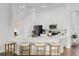 Open kitchen featuring quartz countertops, stainless appliances, and eat-in bar at 1043 Davis Heather Cir, Seffner, FL 33584