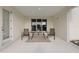View of the screened lanai with table and chairs for outdoor entertaining at 1043 Davis Heather Cir, Seffner, FL 33584