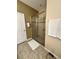 Modern bathroom featuring a stand-up shower with glass enclosure at 11248 Mollymawk Ct, New Port Richey, FL 34654