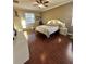 Cozy bedroom featuring modern accents and hardwood flooring at 11248 Mollymawk Ct, New Port Richey, FL 34654