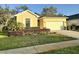 Charming single-Gathering home with well-maintained landscaping and attached two car garage at 11248 Mollymawk Ct, New Port Richey, FL 34654