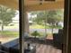 Inviting screened-in patio with a seating area, perfect for enjoying the outdoor views at 11248 Mollymawk Ct, New Port Richey, FL 34654