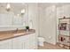 Bathroom featuring a vanity with granite countertops, modern fixtures and a large mirror at 1238 E Kennedy Blvd # 702, Tampa, FL 33602