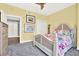 Floral-themed bedroom with a white decorative headboard, closet and entry way at 1238 E Kennedy Blvd # 702, Tampa, FL 33602