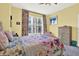 Floral-themed bedroom with a large window offering an exterior view of the city at 1238 E Kennedy Blvd # 702, Tampa, FL 33602