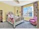Floral-themed bedroom with a large window offering an exterior view of the city at 1238 E Kennedy Blvd # 702, Tampa, FL 33602
