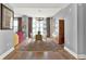 Formal dining room with large windows, a modern chandelier, and hardwood floors at 1238 E Kennedy Blvd # 702, Tampa, FL 33602