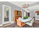 Dining room with a modern chandelier, access to a balcony, and a view of the hallway at 1238 E Kennedy Blvd # 702, Tampa, FL 33602