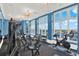 Well-equipped gym with exercise machines, weights, and windows that provide ample natural light at 1238 E Kennedy Blvd # 702, Tampa, FL 33602