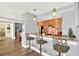 Updated kitchen featuring a breakfast bar with seating, granite countertops, and stainless steel appliances at 1238 E Kennedy Blvd # 702, Tampa, FL 33602