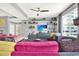 Cozy living room with built-in shelving, large windows, and comfortable seating at 1238 E Kennedy Blvd # 702, Tampa, FL 33602