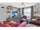 Comfortable living room with built-in shelving, a large window with city views, and plush seating at 1238 E Kennedy Blvd # 702, Tampa, FL 33602
