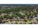 An aerial view of a neighborhood with mature trees and lush landscaping at 14007 Middleton Way, Tampa, FL 33624