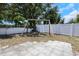 A backyard featuring a classic swing set and lush greenery, inviting outdoor fun at 14007 Middleton Way, Tampa, FL 33624