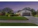 Charming single-story home with manicured lawn and attached two-car garage at 14007 Middleton Way, Tampa, FL 33624