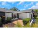 Inviting front entrance showcasing a brick walkway, manicured shrubs, and stylish exterior details at 14007 Middleton Way, Tampa, FL 33624