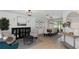 Spacious living room with dining area, hardwood floors, and modern lighting fixtures at 14007 Middleton Way, Tampa, FL 33624