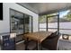 Screened patio features a dining table with a cooler for drinks at 14007 Middleton Way, Tampa, FL 33624