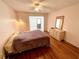 Comfortable bedroom with hardwood floors and a dresser with a mirror at 1473 Feather Dr # 1473, Clearwater, FL 33759