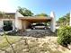 Convenient carport provides covered parking and protection from the elements, with side storage at 1473 Feather Dr # 1473, Clearwater, FL 33759