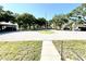 Well-maintained community featuring mature trees, manicured lawns, and convenient parking at 1473 Feather Dr # 1473, Clearwater, FL 33759