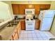 Bright kitchen featuring essential appliances and lots of cabinet storage space at 1473 Feather Dr # 1473, Clearwater, FL 33759
