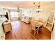 Comfortable living room and dining area featuring hardwood floors and modern lighting at 1473 Feather Dr # 1473, Clearwater, FL 33759