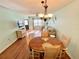 Cozy living and dining area with hardwood floors and ample natural light at 1473 Feather Dr # 1473, Clearwater, FL 33759