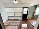 Sunroom featuring windows, flooring, and natural light at 1473 Feather Dr # 1473, Clearwater, FL 33759