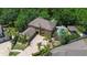 Aerial view of house with well manicured landscaping, long driveway, and in-ground pool at 14809 Ninebark Ct, Land O Lakes, FL 34638