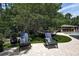 Backyard with chairs, a hammock, and a covered bar area adjacent to the pool at 14809 Ninebark Ct, Land O Lakes, FL 34638