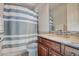 Bathroom featuring a shower curtain, marble countertop, and wooden vanity at 14809 Ninebark Ct, Land O Lakes, FL 34638