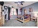 bedroom featuring colorful decor, ceiling fan, carpet, and bright natural light at 14809 Ninebark Ct, Land O Lakes, FL 34638