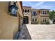 Stunning home featuring a brick driveway, stucco siding, manicured bushes, and a welcoming entrance at 14809 Ninebark Ct, Land O Lakes, FL 34638