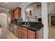 Eat-in kitchen with custom wood cabinets, granite countertops, and stainless-steel appliances at 14809 Ninebark Ct, Land O Lakes, FL 34638
