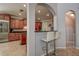 Stylish kitchen with wood cabinets, granite counters, stainless steel appliances, and a breakfast bar at 14809 Ninebark Ct, Land O Lakes, FL 34638