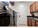 Laundry room including a modern washer and dryer, cabinets, and countertop space at 14809 Ninebark Ct, Land O Lakes, FL 34638
